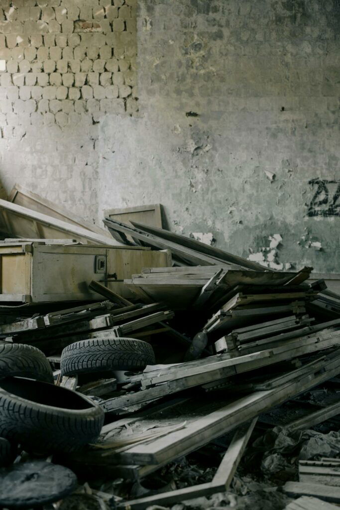 An abandoned building with a lot of rubble that requires property cleanout services.
